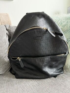 Gucci Black Leather Backpack-Embossed with Gold Hardware